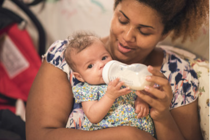 black baby bottle feed